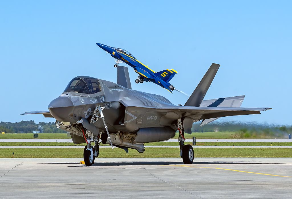 Lockheed F-35C (16-8716) - The Blue Angels lead solo (165805) on takeoff behind an F-35B from VMFAT-501 Warlords, in Low Country, at MCAS Beaufort Airshow, SC on Sunday, 13 Apr 2025. The opposing solo FA-18 is hidden behind the F-35B.