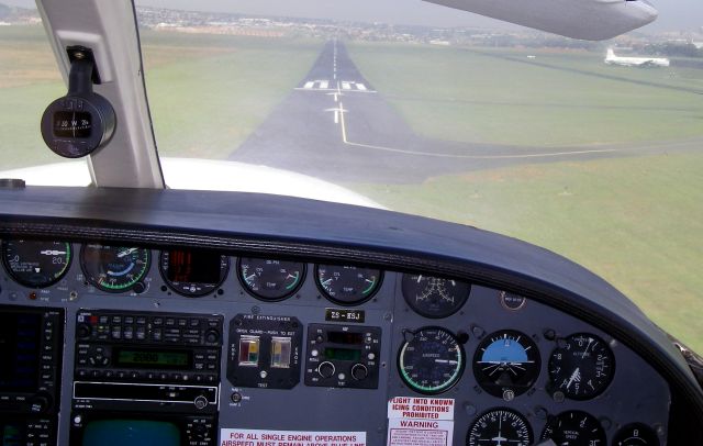 Cessna 421 (ZS-KSJ) - Landing at Rand Airport, South Africa.