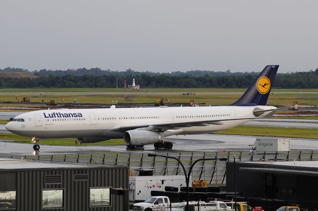 Airbus A330-300 (D-AIKJ) - Seen at KIAD on 7/25/2009.  Dark overcast, light rain.