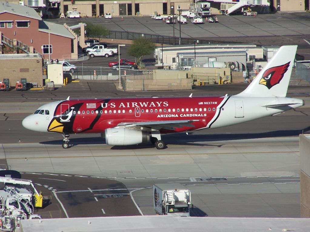 Airbus A319 (N837AW) - N837AW US Airways A319 is painted in Arizona Cardinals colours and is seen taxiing at PHX 20th March 2010