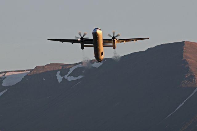 de Havilland Dash 8-400 (TF-FXA) - TF-FXA dwarfed by the mountains behind Akureyri airport in Iceland on departure to Reykjavik.