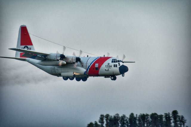 Lockheed C-130 Hercules — - A USCG C-130 coming in early in the morning