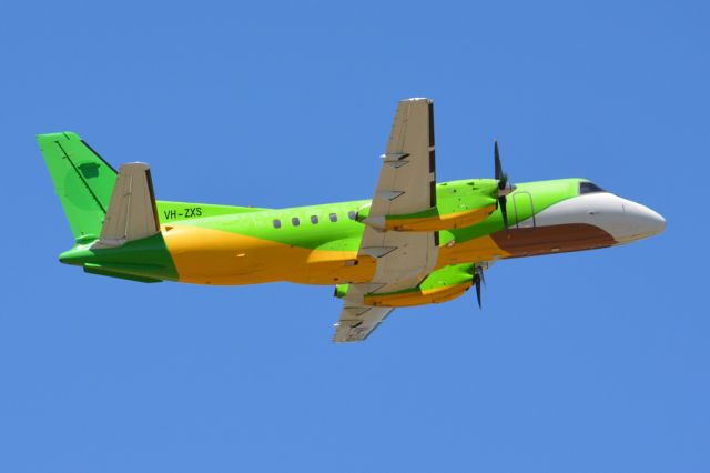 Saab 340 (VH-ZXS) - Getting airborne off runway 23 and heading off to another regional destination. Still in the livery of its former operator, Thailand's Happy Airlines. Thursday 6th March 2014.