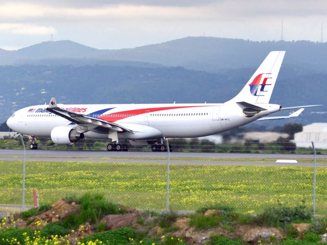 Airbus A330-300 (9M-MTC) - Rolling for take off on runway 05, for flight home to Kuala Lumpur, just before the arrival of a rain storm. Thursday 12th July 2012.