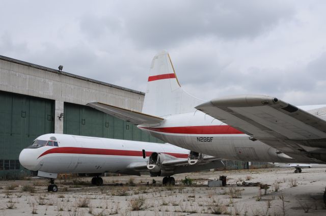 Lockheed L-188 Electra (N286F) - A pair of forlorn Electra's rotting away in corrosion corner at YIP