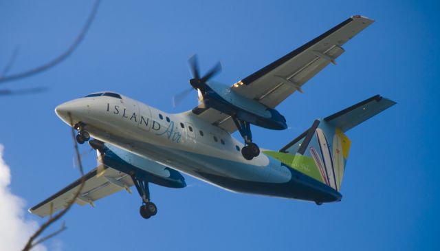 de Havilland Dash 8-100 (N806WP) - Landing on RW 35 just past the lighthouse in Lihue