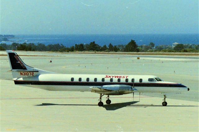 Fairchild Dornier SA-227DC Metro (N31072) - KMRY - with the Pacific Ocean rolling in the background, this Skywest Metro turns for the main runway for Los Angeles to catch the American Eagle that is in position and hold, This was a great Obs deck before airport officials made that terrible error and put the big glass wall up ruining another great west coast vantage point.