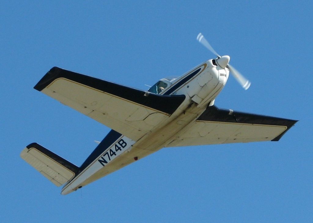 Beechcraft Bonanza (36) (N744B) - 1948 Beech A35 taking off of 23 at Downtown Shreveport.