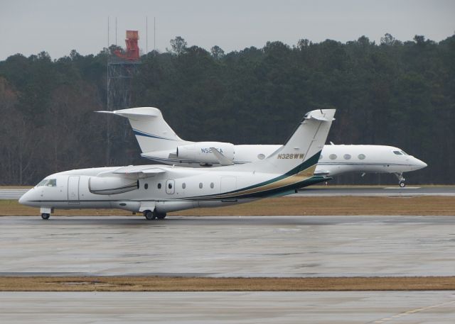 Fairchild Dornier 328 (N328WW) - N524EA in the background getting ready to depart.