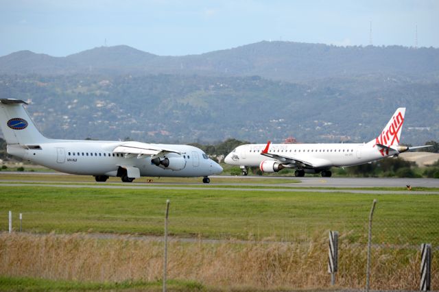Embraer ERJ-190 (VH-ZPE) - Rolling for take-off on runway 05. Thursday, 19 June 2014.