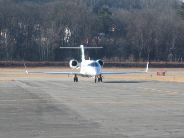 Learjet 45 (N942FK) - Sun glinting of this beautiful Lears fuselage.