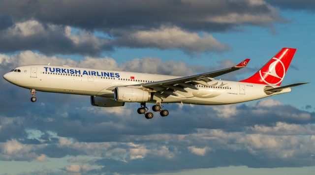 Airbus A330-300 (TC-LOA) - Epic light illuminates this Turkish A333 about to land on 06L