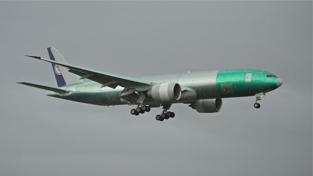 Boeing 777-200 (D-ALFA) - BOE156 on final to Rwy 16R during a rain squall to complete its maiden flight on 9.23.13. (LN:1144 cn 41674).  This will be the first Boeing 777 for Lufthansa Cargo.