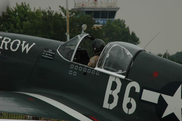 North American P-51 Mustang — - The old tower behind a Mustang