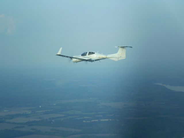 Diamond Twin Star (N147TS) - 2006 DA-42 TwinStar G100    www.huntsvilleflightcenter.com  Flight over Wheeler Lake, AL  Huntsville Flight Center Training and Rental Aircraft   1-256-461-1448