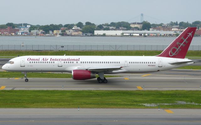 Boeing 757-200 (N639AX) - Omni Air 757-200 N639AX in a long line for departure at KLGA in May 2012 operating sub-service for Spirit while their sole A-321 is in Heavy Maintenance.