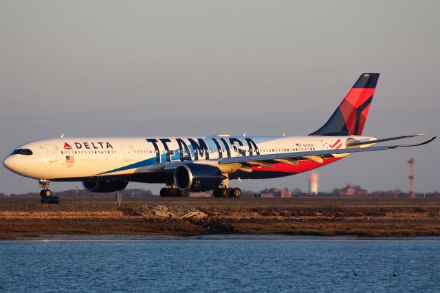 Airbus A330-900 (N411DX) - Delta A339 in special Team USA livery departing BOS for AMS on 4/5/22.