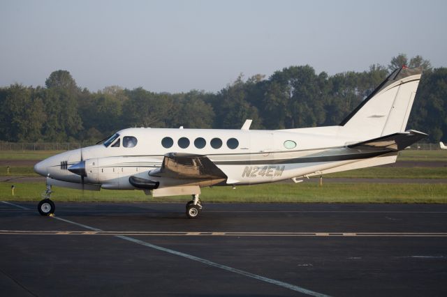 Beechcraft King Air 100 (N24EM) - CFMs (Corporate Flight Management) King Air 100 taxiing out for a departure runway 08 at Danbury CT.