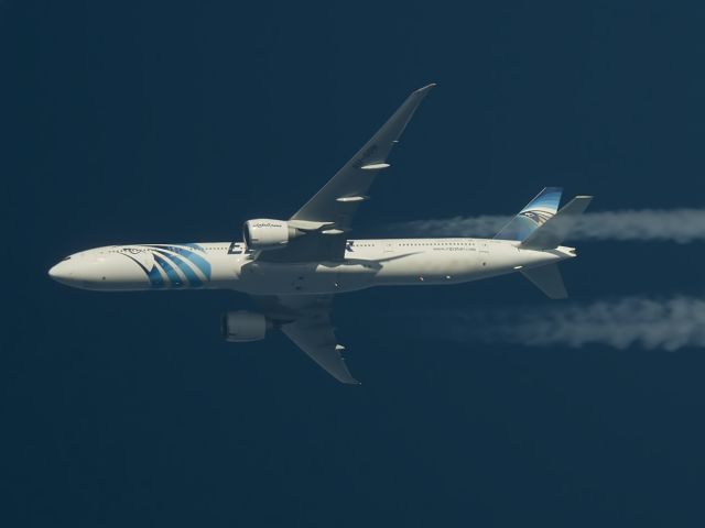 BOEING 777-300 (SU-GDN) - EGYPTAIR B773 Photographed 28-12-2014 Passing Overhead West Lancashire , England ,UK at Altitude 34,000ft Working Route Cairo-New York JFK. (MSR985).<br> <br>The livery scheme on this aircraft is one of my favorites.<br>A real treat when this one passed by giving me the opportunity to photograph my first Egyptair Aircraft.<br> <br>Another Higher resolution frame of this very fine livery work from Egyptair depicting the Pharoah Tutankhamuns Head Mask design on the front fuselage and tail.<br> <br>Airline Flag carrier artwork doesnt get any better than this. Pentax K-5.