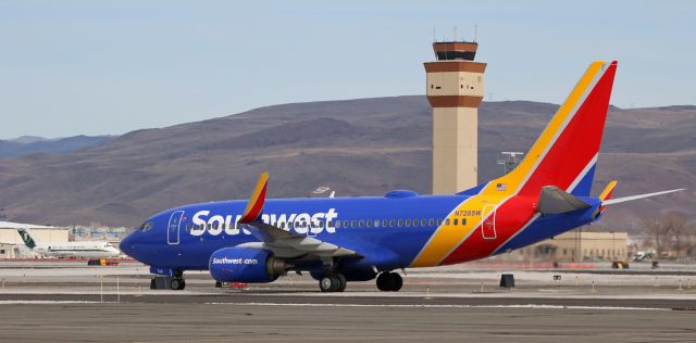 Boeing 737-700 (N728SW) - SWAs N728SW is viewed here as it is beginning to taxi north toward the Southwest terminal area after landing on runway 16R at Reno Tahoe Intl. 