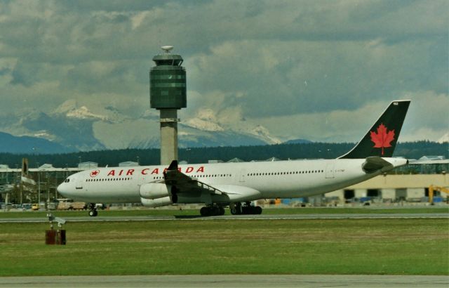 Airbus A340-300 (C-FTNP) - CYVR - Air Canada A340-300 departing for ( and I'm guessing Toronto or Europe) April 1999 from the south terminal parking lot.