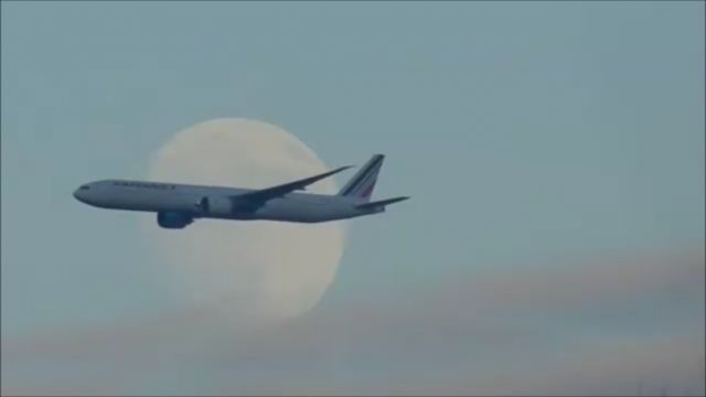 BOEING 777-300ER (F-GSQG) - An Air France Boeing 777-300ER Approaches Dulles International Airport While Overlapping The Moon!