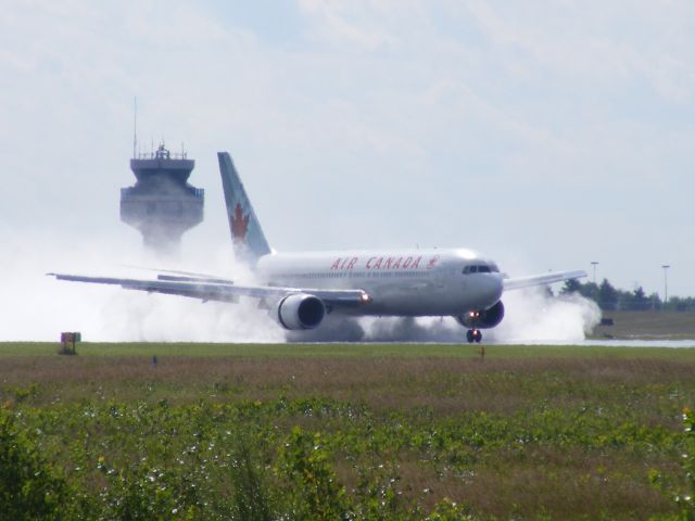 C-FTCA — - landing on a wet runway