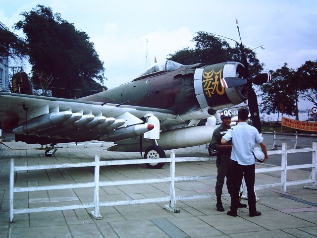 — — - TAN SON NHUT AIR BASE, SAIGON, VIETNAM 1966 - A South Vietnamese Air Force A-1E Skyraider on display in Saigon.