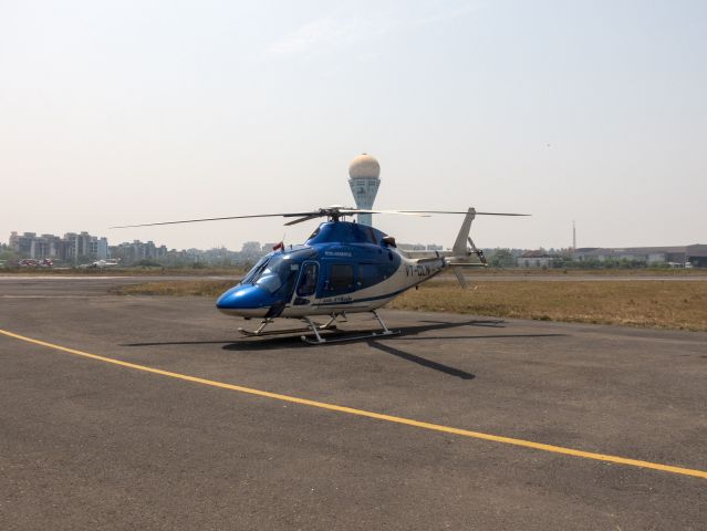 VT-CLN — - 25 MAR 2018 in India. Busy heliport serving the offshore oil industry.