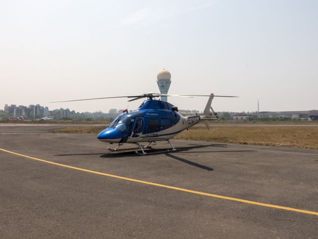 VT-CLN — - 25 MAR 2018 in India. Busy heliport serving the offshore oil industry.