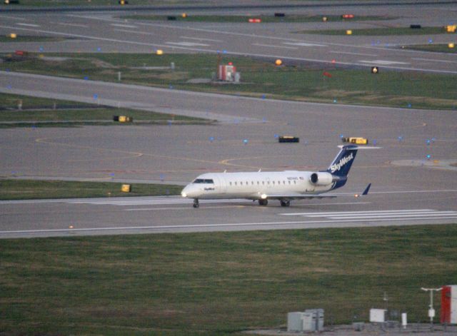 Canadair Regional Jet CRJ-200 (N874AS) - Skywest 5948 makes an evening departure for Denver.