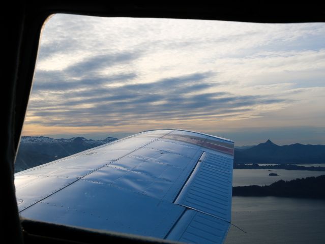 Piper Saratoga (N8374P) - N8374P decending over Chiniak, Alaska, during a beautiful sunset, with Pyramid Mountain and Kodiak Benny Benson Airport (PADQ) just behind the wing.br /Special thanks to Jim for making this possible!br /Photo date: 6-17-25br /Upload date: 2-6-25