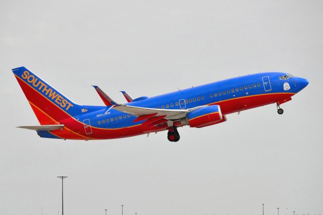 Boeing 737-700 (N906WN) - Departing 23-L 10-09-20. Charles Taylor - First Mechanic sticker on the nose.