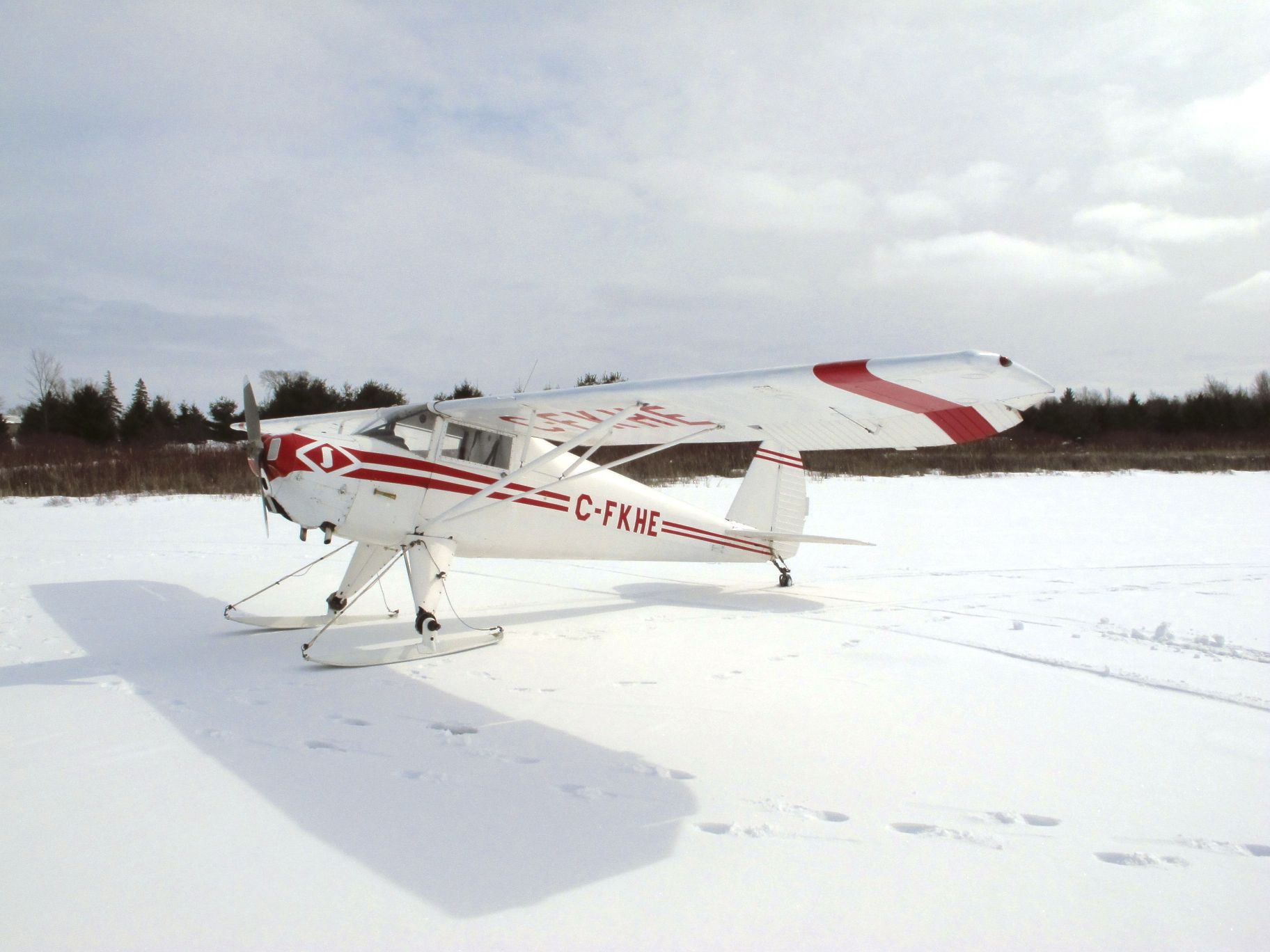 TEMCO Silvaire (C-FKHE) - Luscombe 8C sitting pretty on skis for a fly-in on a frozen Camden Lake, near Yarker, Ontario, Canada on March 3rd, 2013