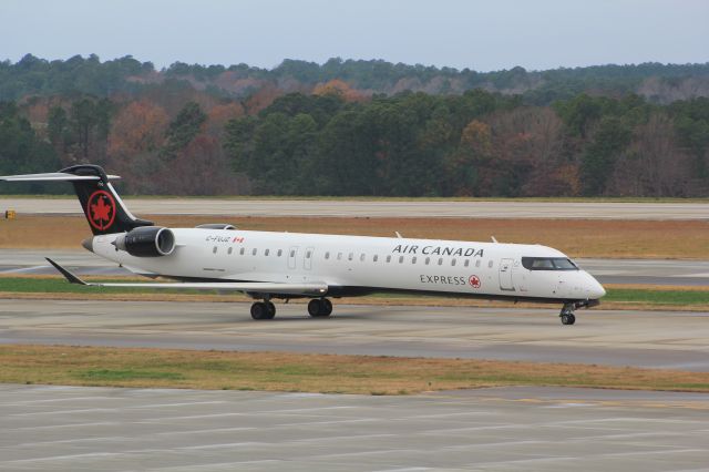 Canadair Regional Jet CRJ-900 (C-FUJZ) - Taken on December 3, 2023, at the RDU Observation Deck. This Air Canada Express Mitsubishi CRJ-900LR is taxiing to the runway for it's departure to Toronto-Pearson (YYZ).