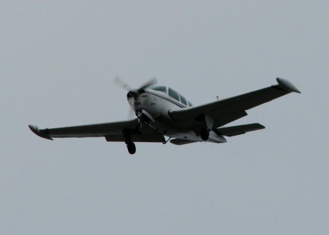 Beechcraft Bonanza (36) (N75AT) - Landing at Shreveport Regional. Rainy, Overcast day!