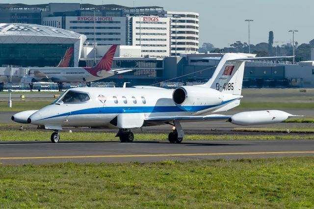 Learjet 35 (B-4185) - Chinese Government Learjet 36 taxies past "Shep's Mound" at Sydney airport