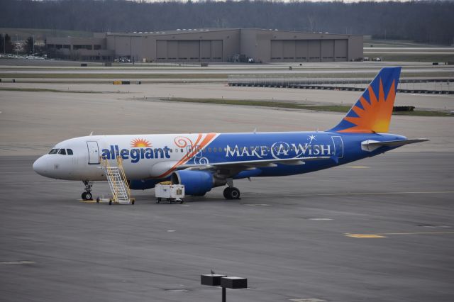 Airbus A319 (N218NV) - Allegiant "Make a Wish" Livery sitting at CVG.