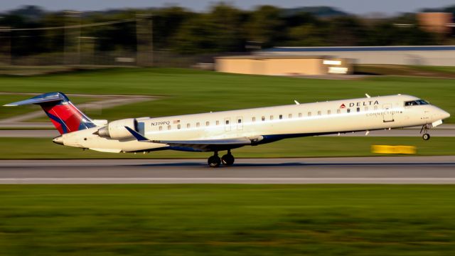 Canadair Regional Jet CRJ-900 (N319PQ) - An Endeavor CRJ9 rotates out of CVG in the morning light.