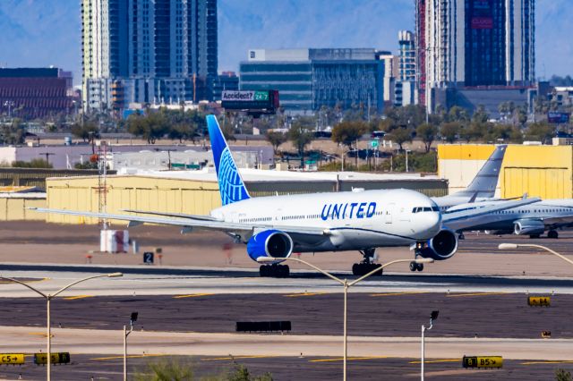 Boeing 777-200 (N777UA) - A United Airlines 777-200 taking off from PHX on 2/10/23 during the Super Bowl rush. Taken with a Canon R7 and Tamron 70-200 G2 lens.