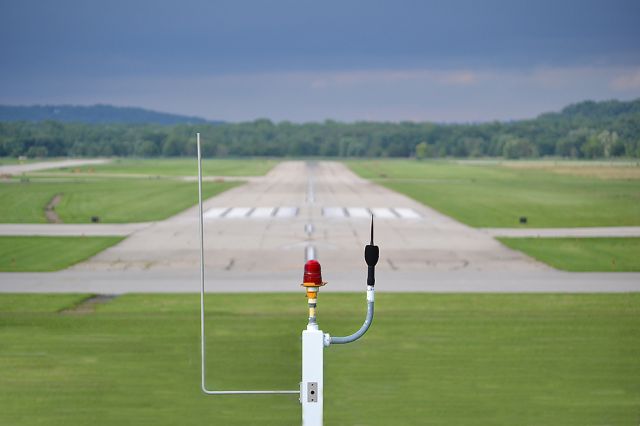 — — - Conducting Airplanes!<br><br>Looking down RWY 7 at KLUK. This vantage point is atop a 24 ft. levee protecting the airport from the Ohio and Ltitle Miami Rivers.