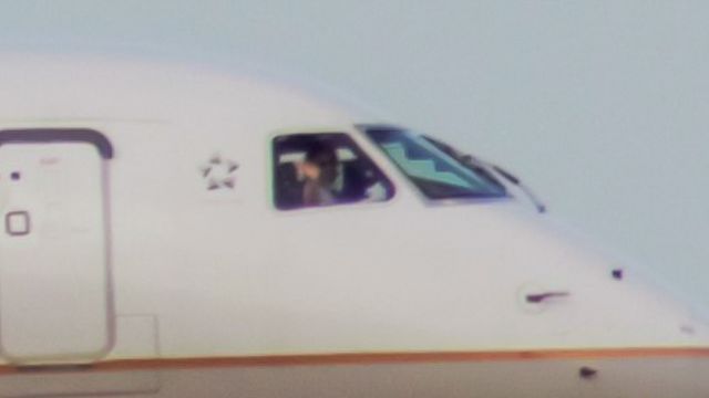 Embraer 170/175 (N858RW) - The co-pilot giving us a wave while on final for runway 18L at CVG!