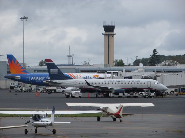 N123HQ — - Allegiants (N218NV) A320-214 in the background. Allegiant is referred to as "Wheelchair Air" due to the number of Snowbirds that utilize the Maine to Florida corridor.