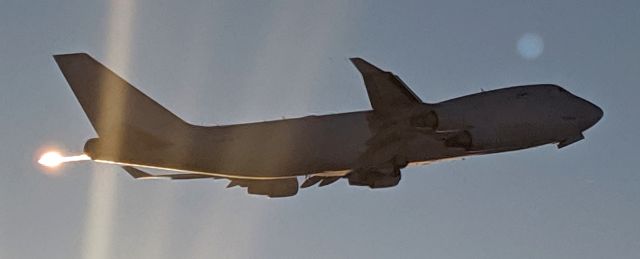 Boeing 747-400 (N445MC) - East end of N-S runway at sunset, takeoff