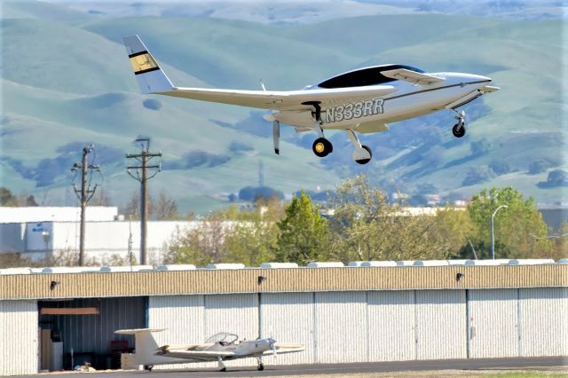 VELOCITY Velocity (N333RR) - N333RR Velocity departs Livermore Municipal Airport while N543X Aeromot wings folded is getting returned to it's hanger.