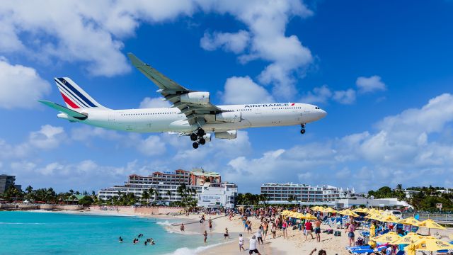 Airbus A340-300 (F-GLZO) - A sight never to be seen again over maho beach. Air France Airbus A340-300 F-GLZO landing at St Maarten.