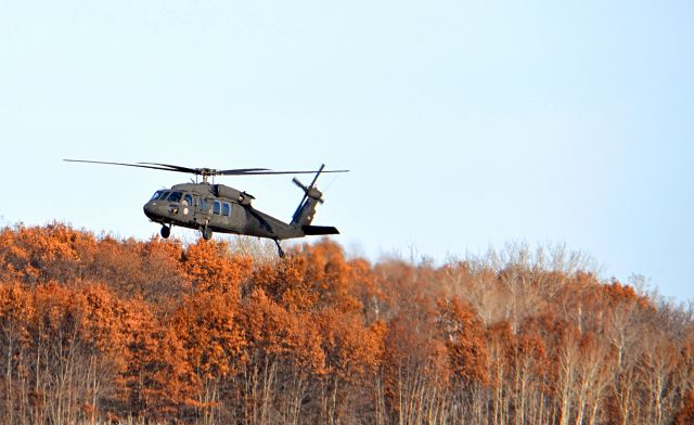 — — - Minnesota National Guard UH60 messing around. The number on the tail is 125