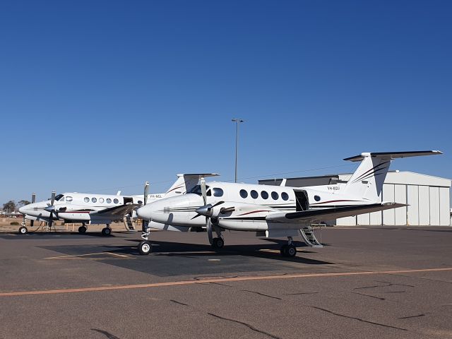 Beechcraft Super King Air 200 (VH-XGV) - VH-XGV on apron at Moomba next to VH-NGL