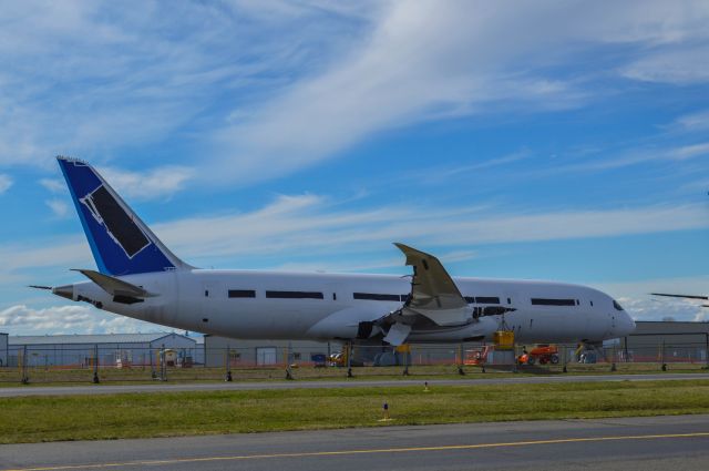 Boeing 787-8 — - An unknown 787 awaits final assembly. Note the huge yellow boxes that substitute the weight of an engine. 