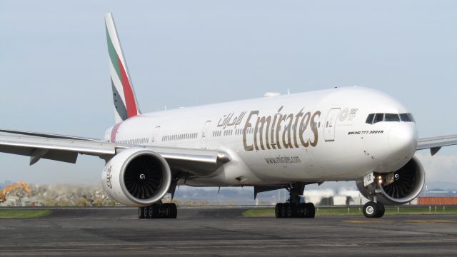 BOEING 777-300ER (A6-EQD) - Vacating the runway from Dubai via Kuala Lumpur.